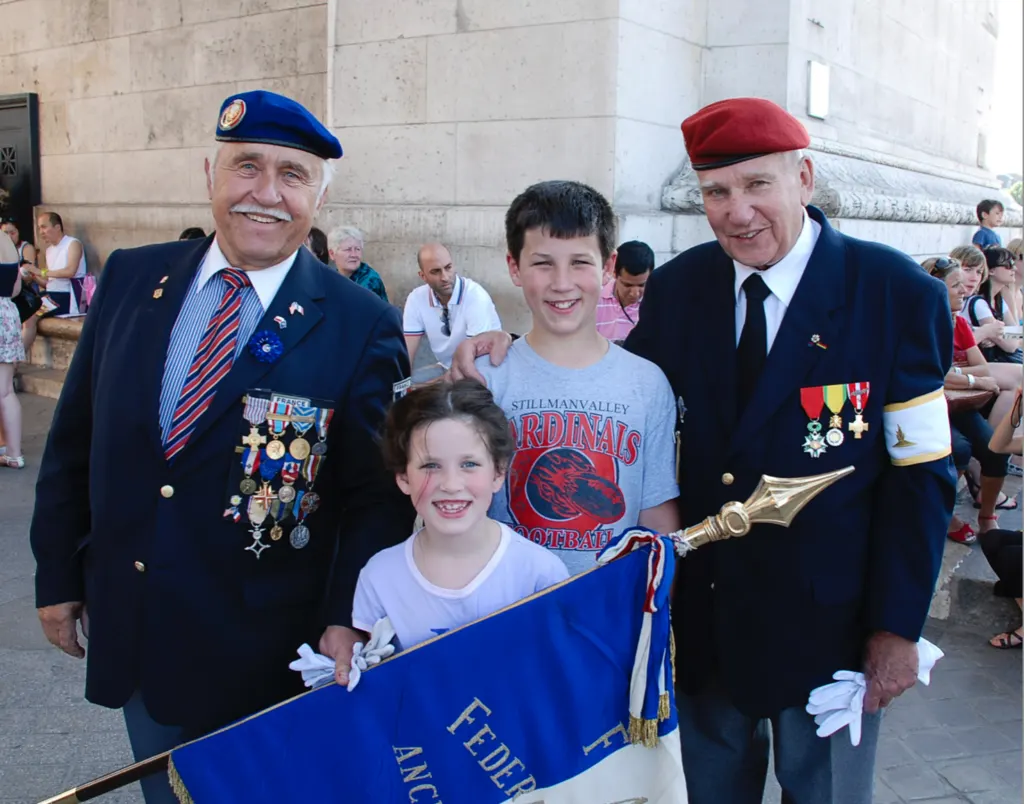 Our 2 youngest with French veterans at the Arc de Triomphe (2010)